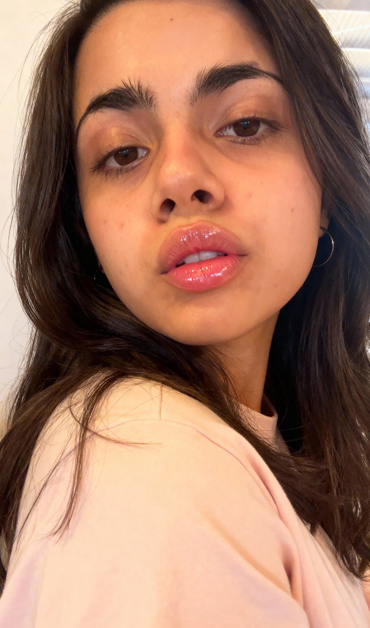 Selfie d’une cliente portant l’huile à lèvres Exotic Extreme Noir