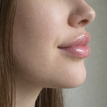 Side view of glossy lips with Extreme Plump Injection